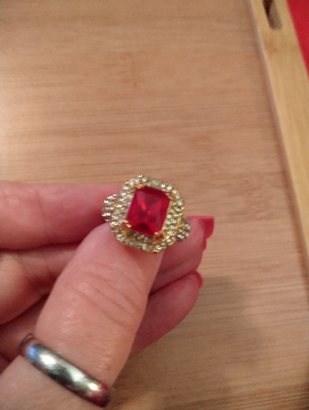 Gold Ring with Red Gemstone and Crystal Halo